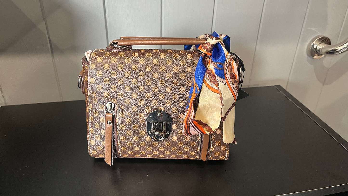 Patterned satchel-style handbag with a scarf accessory