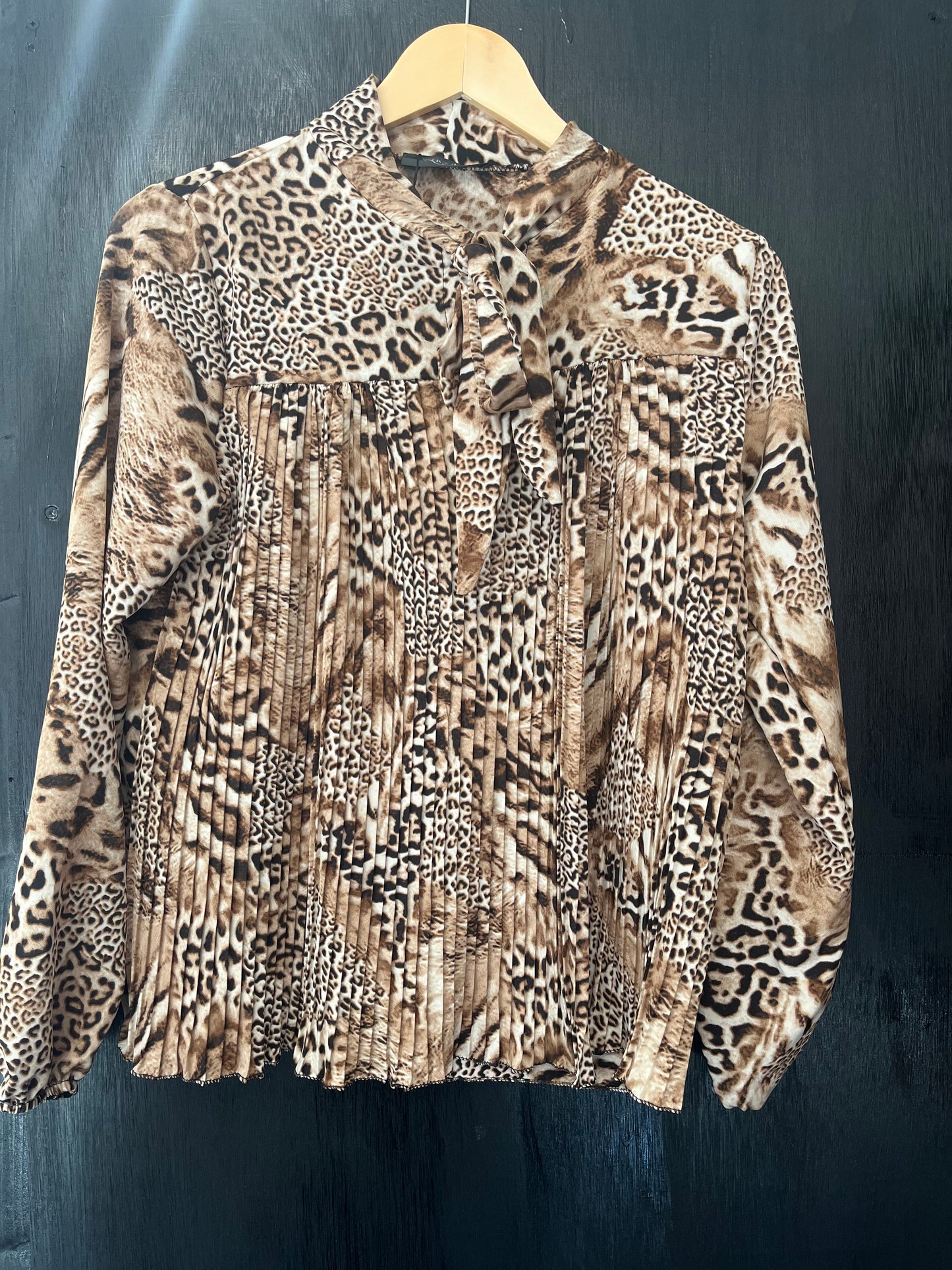ladies pleat front tie neck animal print top
