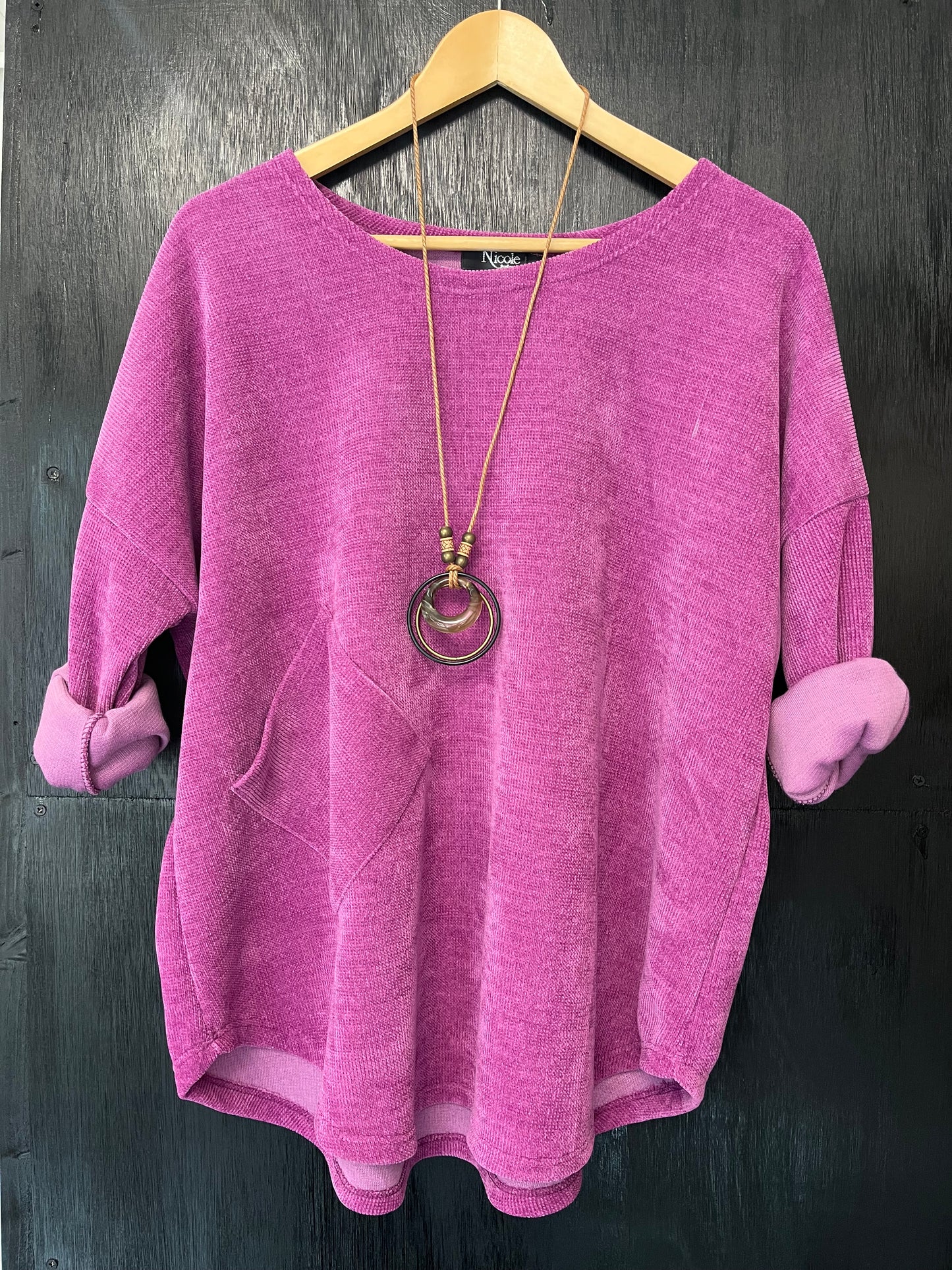 heavy cord style fabric long sleeve jumper with pocket detail and necklace