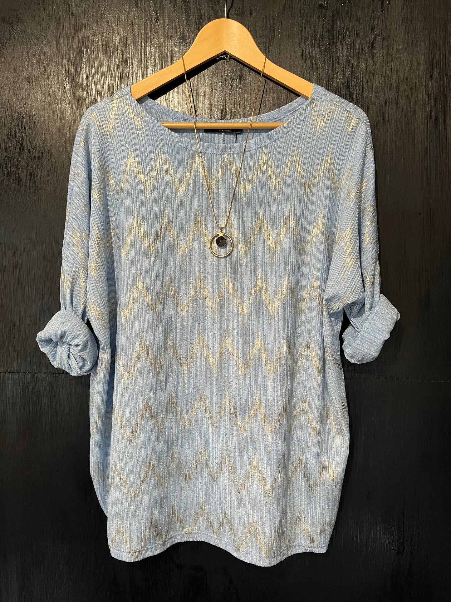textured top with a zig zag foil design and necklace