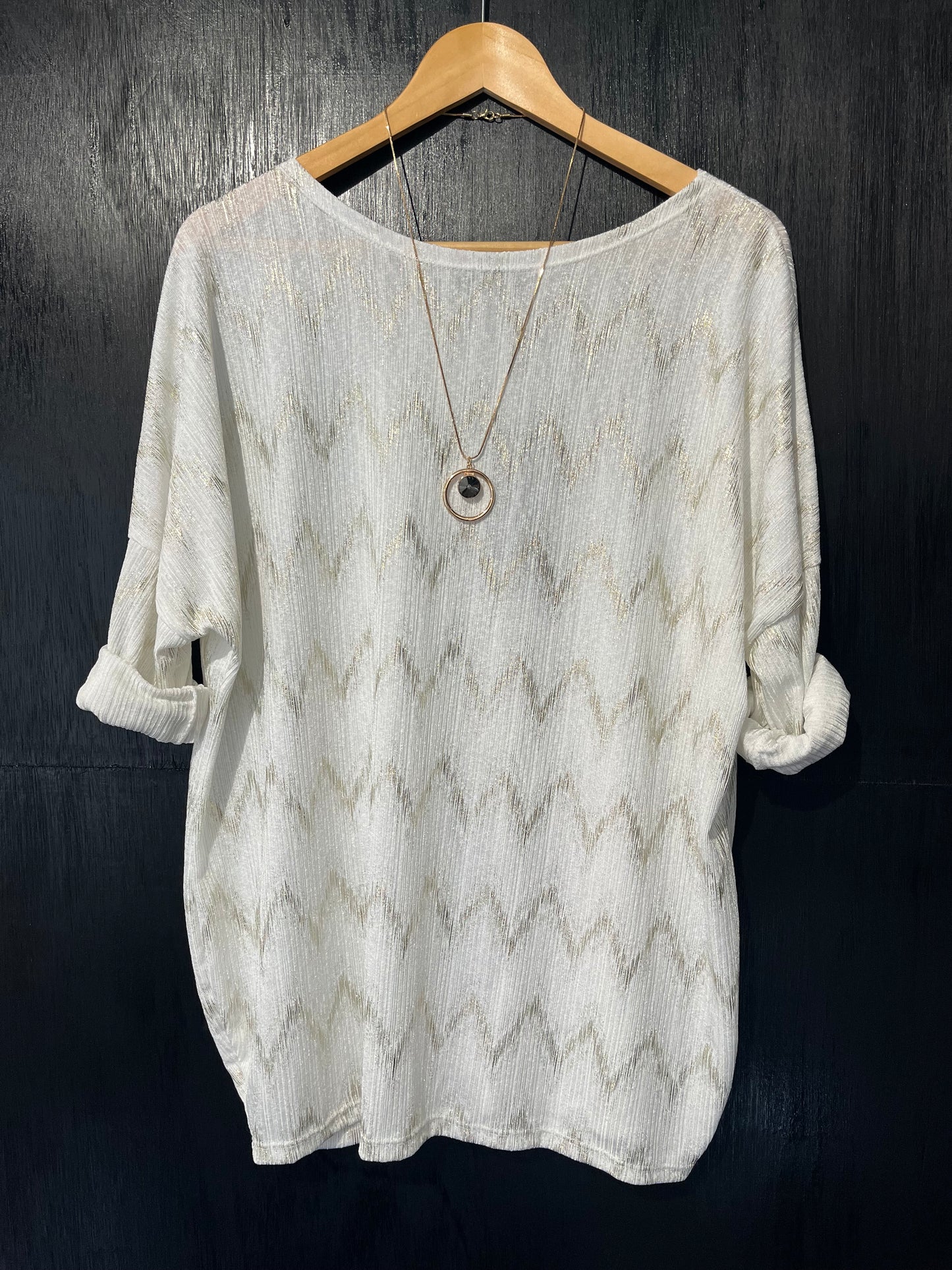 textured top with a zig zag foil design and necklace