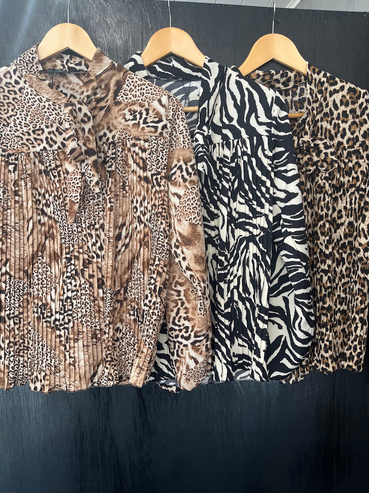 ladies pleat front tie neck animal print top