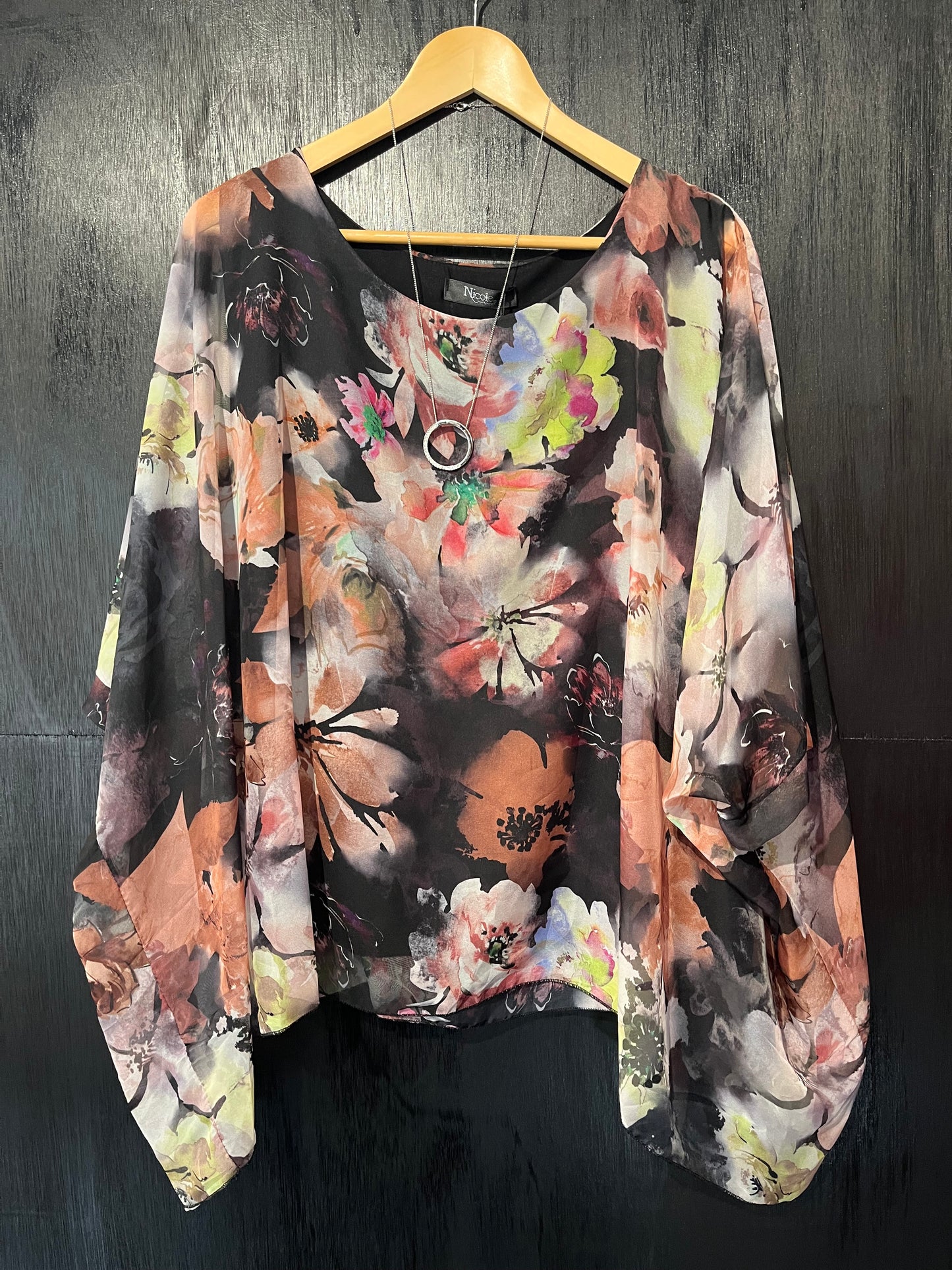 soft printed chiffon cape top with attached lined vest and stunning necklace