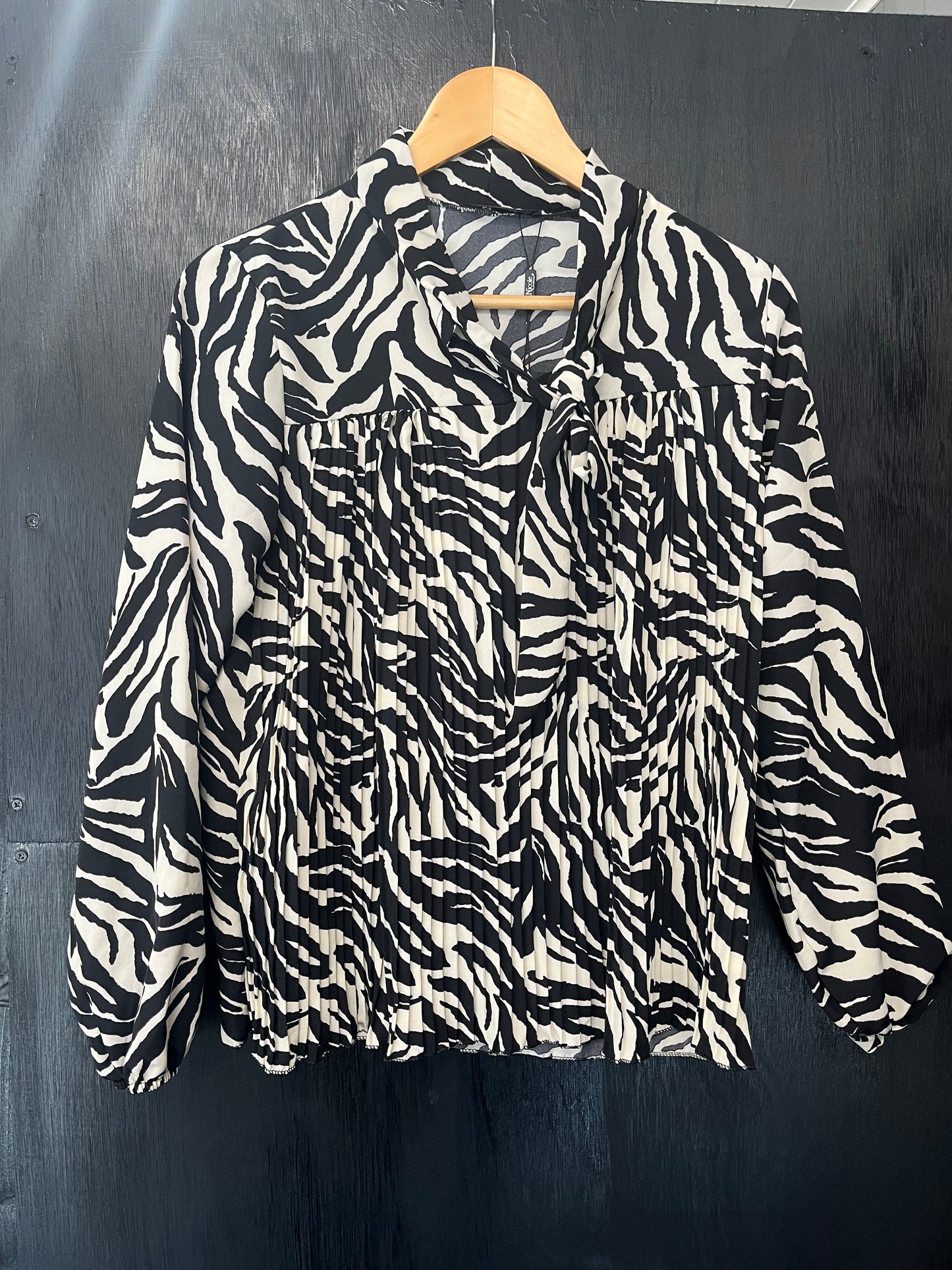 ladies pleat front tie neck animal print top