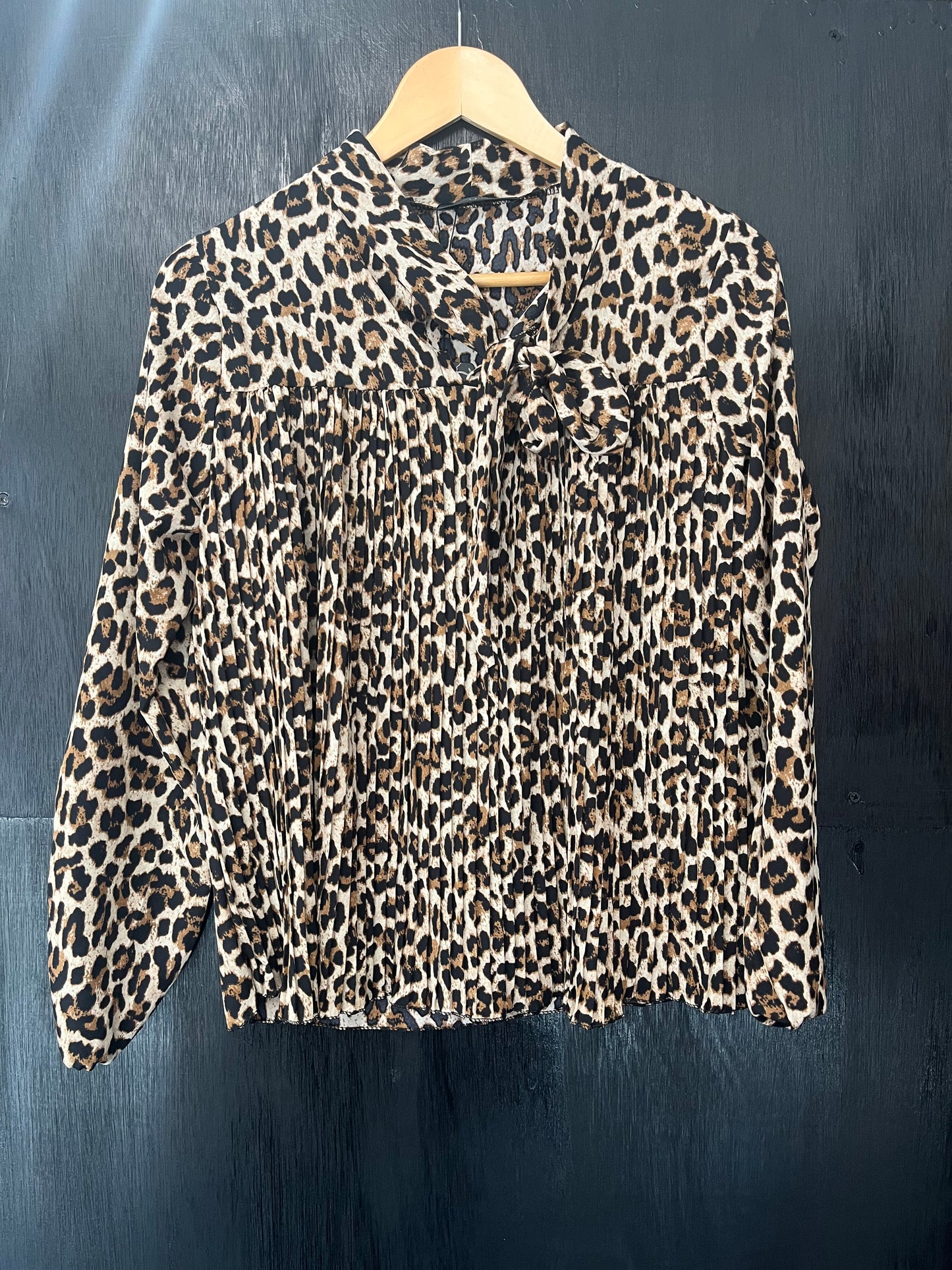 ladies pleat front tie neck animal print top