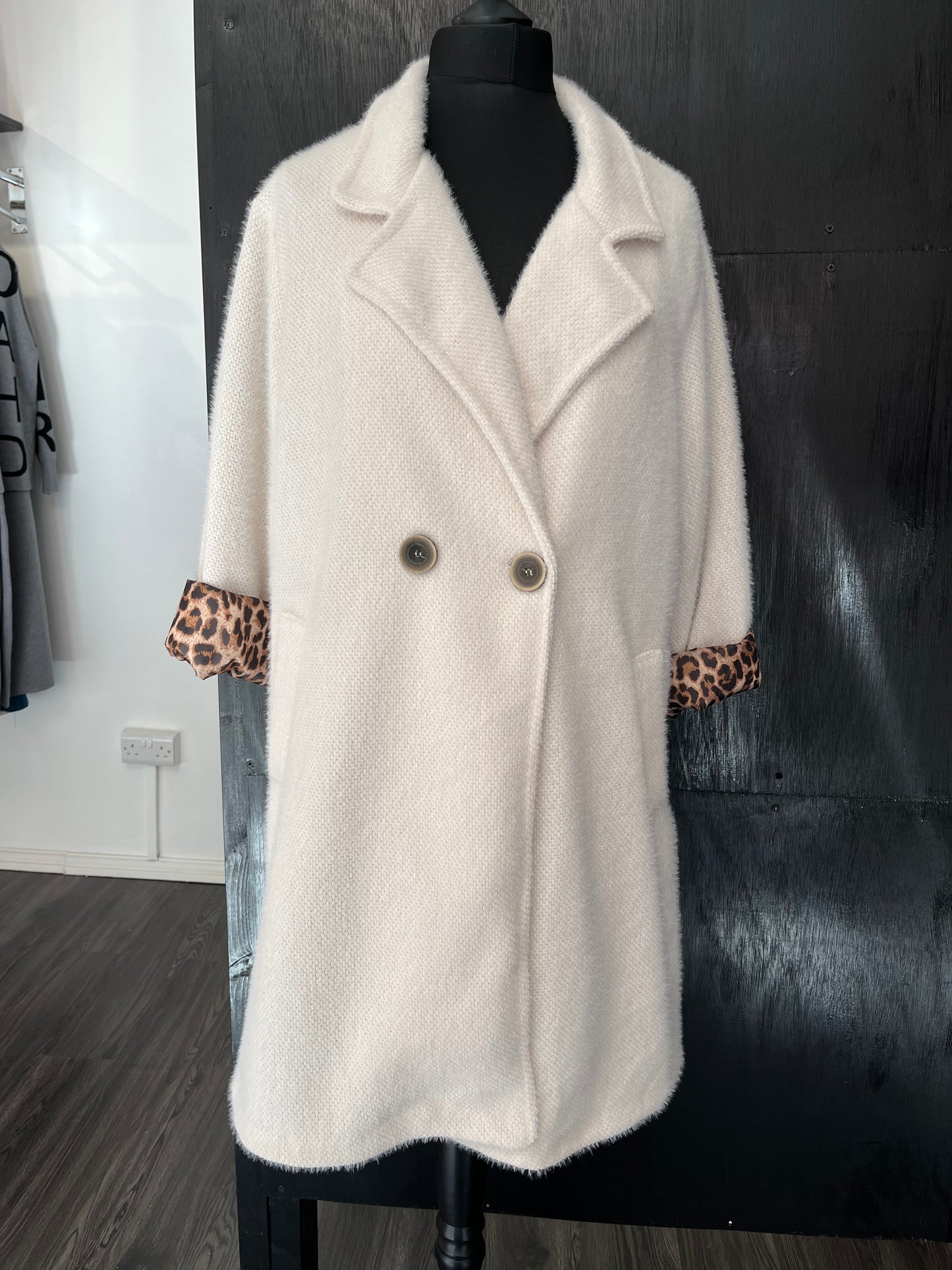 long button front pocket coat with animal print lining