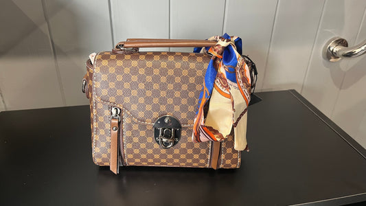 Patterned satchel-style handbag with a scarf accessory