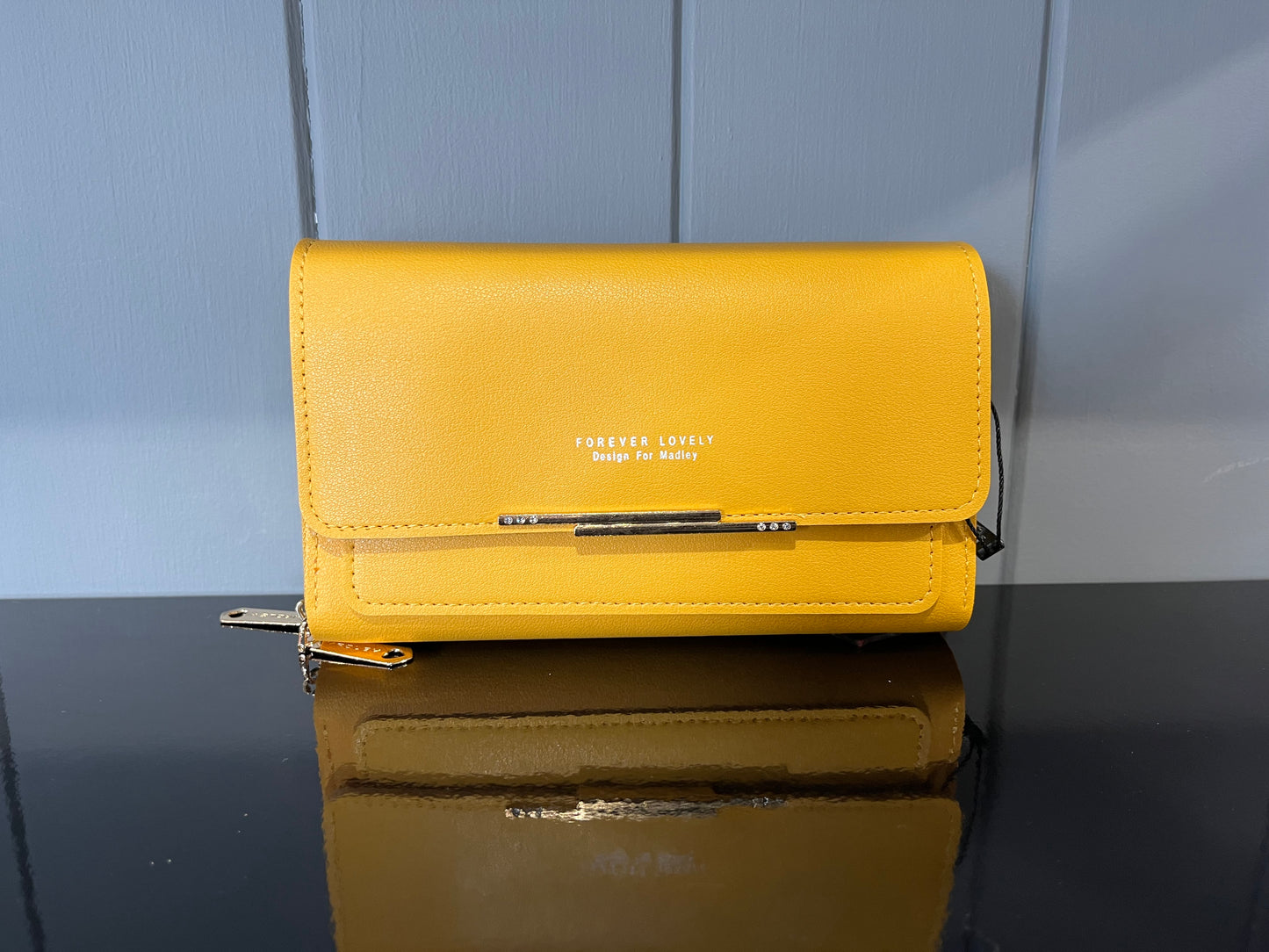 Body cross bag with multiple card slots and phone holder feature