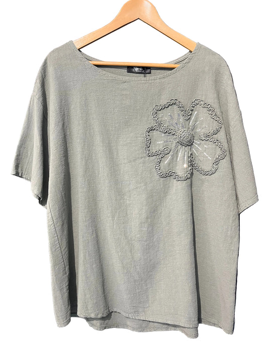 natural cotton top with a sequined floral embellishment