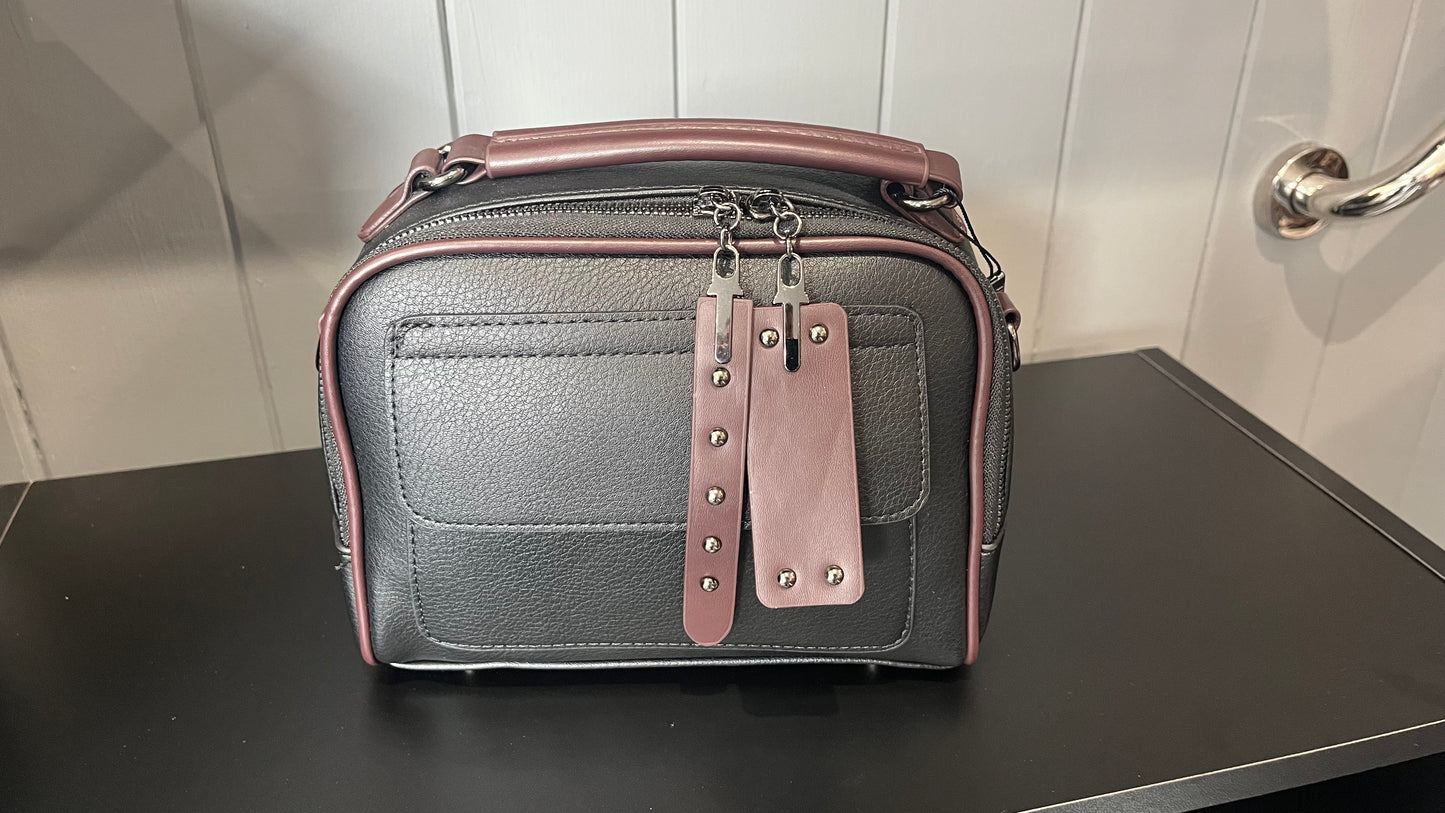 Black & brown clutch handbag with front pocket also comes with shoulder strap