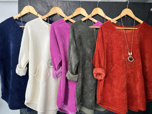 heavy cord style fabric long sleeve jumper with pocket detail and necklace