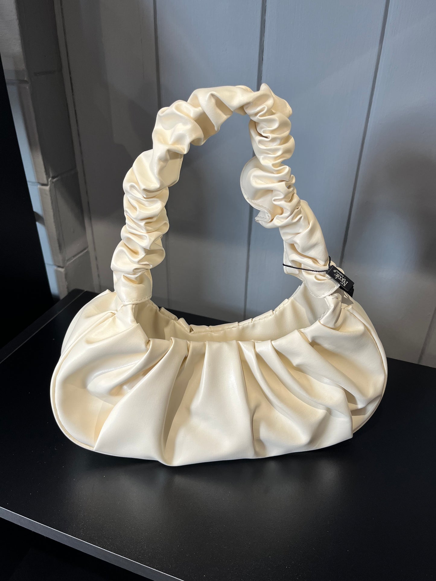 Hobo handbag with pleated handle