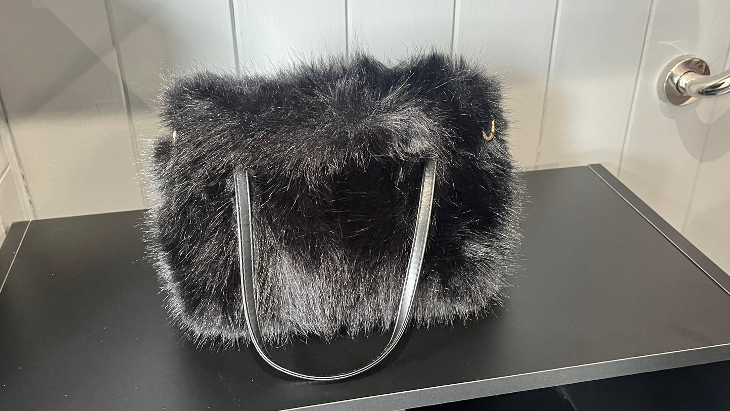 Faux fur clutch bag with PU handles
