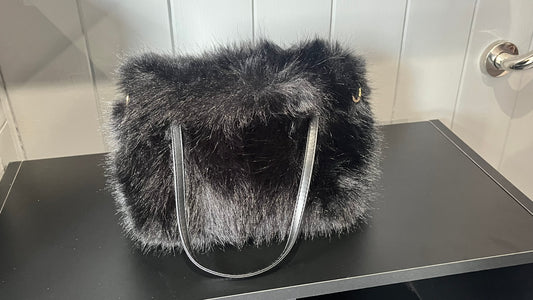 Faux fur clutch bag with PU handles